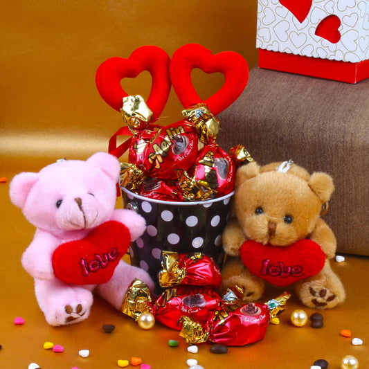 Love Couple Teddy holding a heart with Chocolates